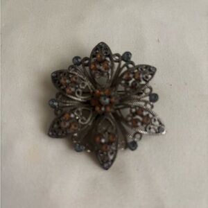 Elegant Silver and Brown Floral Brooch